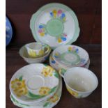 Nine items of Clarice Cliff Crocus teawares and seven items of Grindley teawares