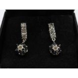 A pair of sapphire and diamond earrings