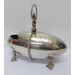 A plated Mappin Brothers 'bullet' shaped sugar hod with four fish feet,