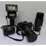 A Canon A-1 35mm film camera, Vivitar Series 1 Macro Focusina lens, two other lenses,