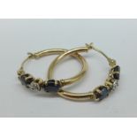A pair of 9ct gold, sapphire and diamond earrings, 1.