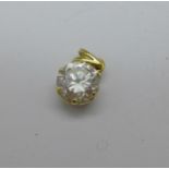 An Arabian 'Desert Diamond' quartz pendant in an 18ct gold mount,