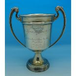 A silver two handled trophy with inscription, 'Presented by Sir Thomas Shipstone K.T. J.P.