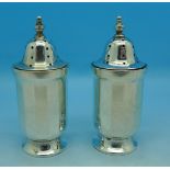 A pair of silver pepperettes,