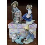 A Lladro figure, three Nao figures, (two boxed) and a Spanish Elisa figure,