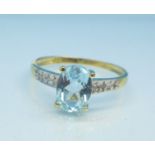A 9ct gold and blue topaz ring, 1.