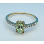 A 9ct gold, green and white stone ring, 1.