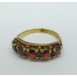 A 9ct gold and five stone garnet ring, 2.