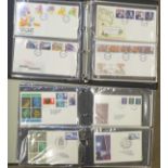 Two albums of First Day Cover stamps,