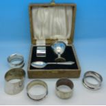 A plated Christening set, four silver napkin rings, 66g,