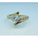 A 9ct gold, blue topaz and diamond ring, 1.