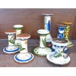 Eight Torquay Ware candlesticks