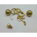 A pair of 9ct gold earrings, a pair of yellow metal earrings, two 9ct gold pendants,