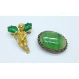A jadeite and white metal clip brooch marked CHINA and a gilt metal cherub brooch with green stones