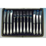 A cased set of six silver handled knives and pastry forks