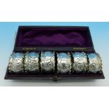 A cased set of six silver napkin rings, Birmingham 1911,