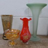 Three glass vases and a carnival glass bowl