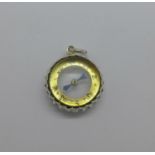 A silver mounted compass charm