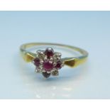 An 18ct gold, platinum set ruby and white stone ring, 2.