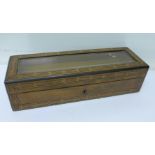 A 19th Century inlaid box with bevel edge glazed top