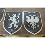 Two reproduction armorial cast iron badges