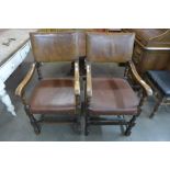A pair of oak and leather armchairs