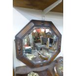 An octagonal oak framed mirror