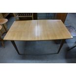 A teak extending dining table