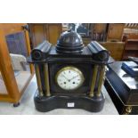 A 19th Century French Belge noir mantel clock, the movement signed Marti & Cie.