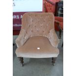 A Victorian mahogany and upholstered button back armchair