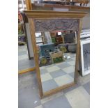 A carved oak mirror