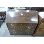 A George III flame figured mahogany bureau