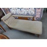 A Victorian carved beech upholstered chaise longue