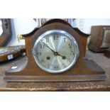 An oak mantel clock