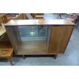 A teak display cabinet