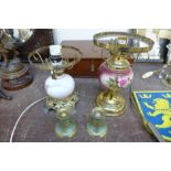 Two brass and porcelain table lamps and a small pair of brass candlesticks
