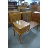 A Chippy teak telephone seat