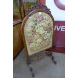 A Victorian walnut embroidered firescreen