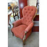 A Victorian mahogany and upholstered spoonback armchair
