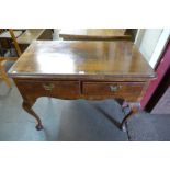 A George II inlaid walnut two drawer side table