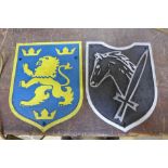Two reproduction armorial cast iron badges