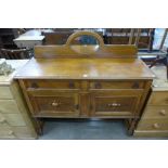 An oak mirrorback sideboard