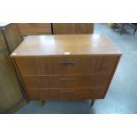 A teak chest of drawers