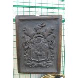 A carved oak armorial wall plaque