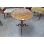 A George III mahogany circular dish top tripod table