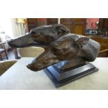 A bronzed bust of two greyhounds