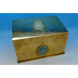 A gilt metal box with sloped top and mounted with two cameo plaques, possibly French,