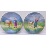 A pair of hand decorated Limoges dishes, diameter 30.