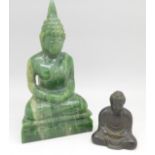 A carved green stone deity and a small bronze Buddha,