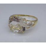 A 9ct gold, white topaz and diamond ring, 1.